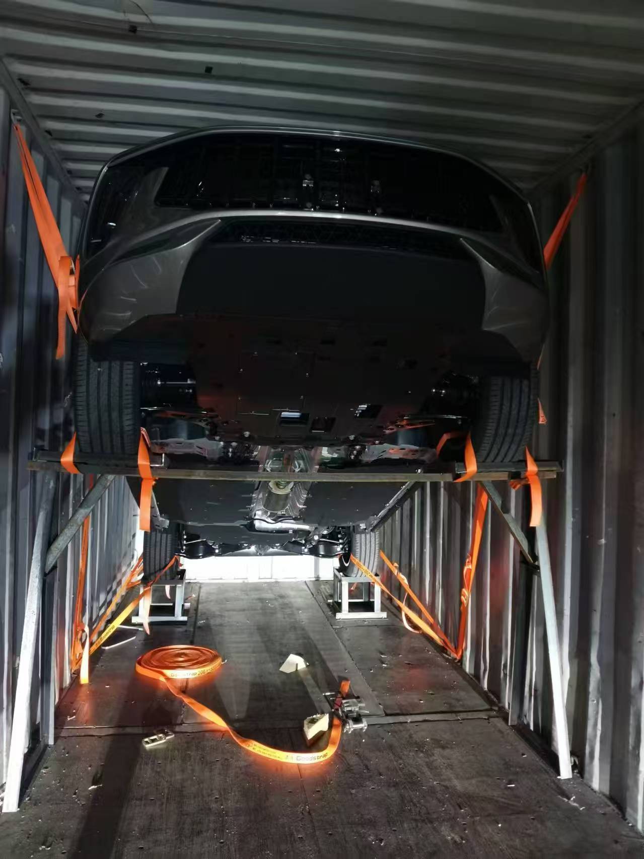 Pickup trucks and SUVs ready for shipment at Baoding Quanzhu’s logistics hub