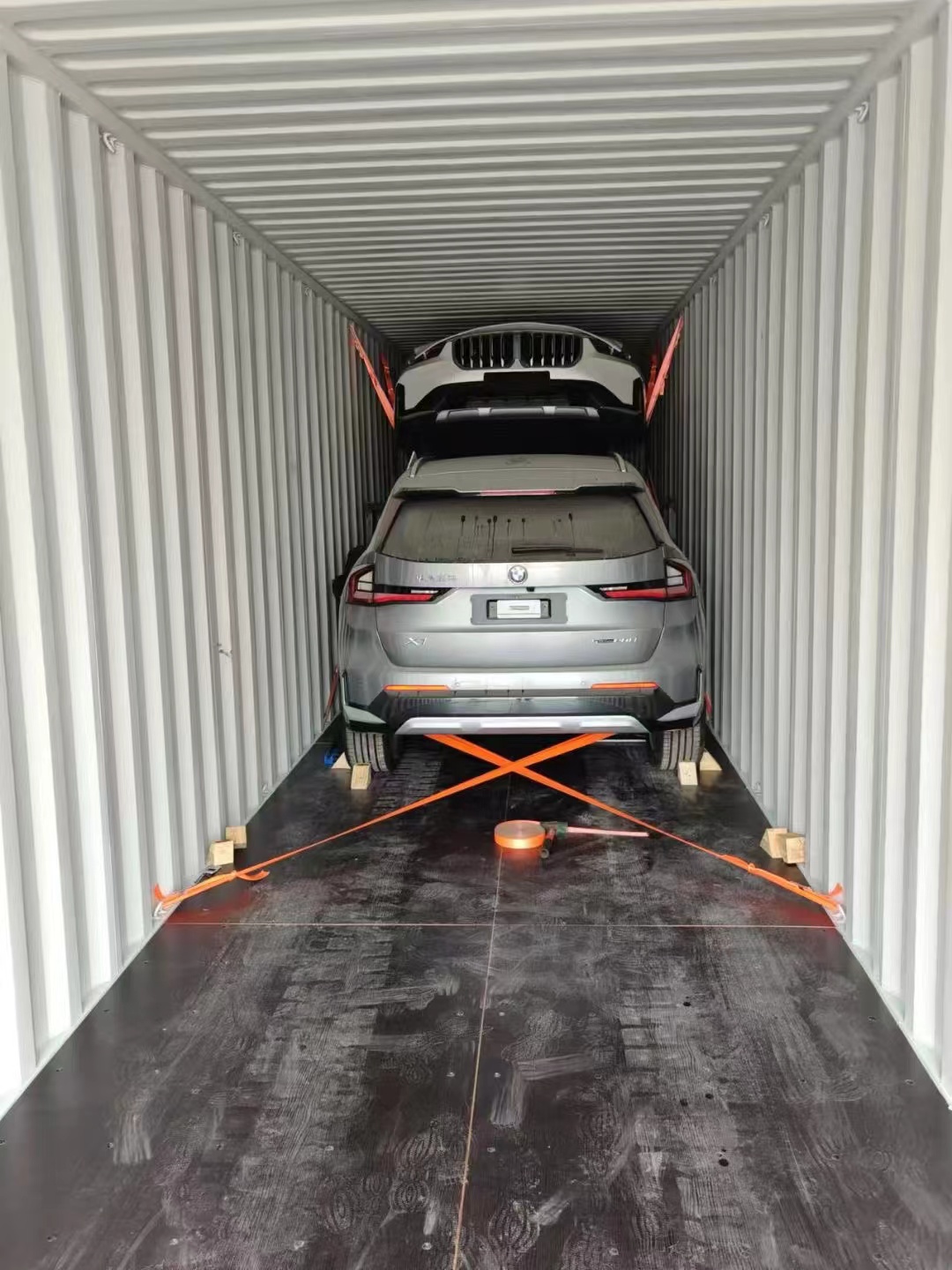 Securing used cars inside shipping containers for international delivery